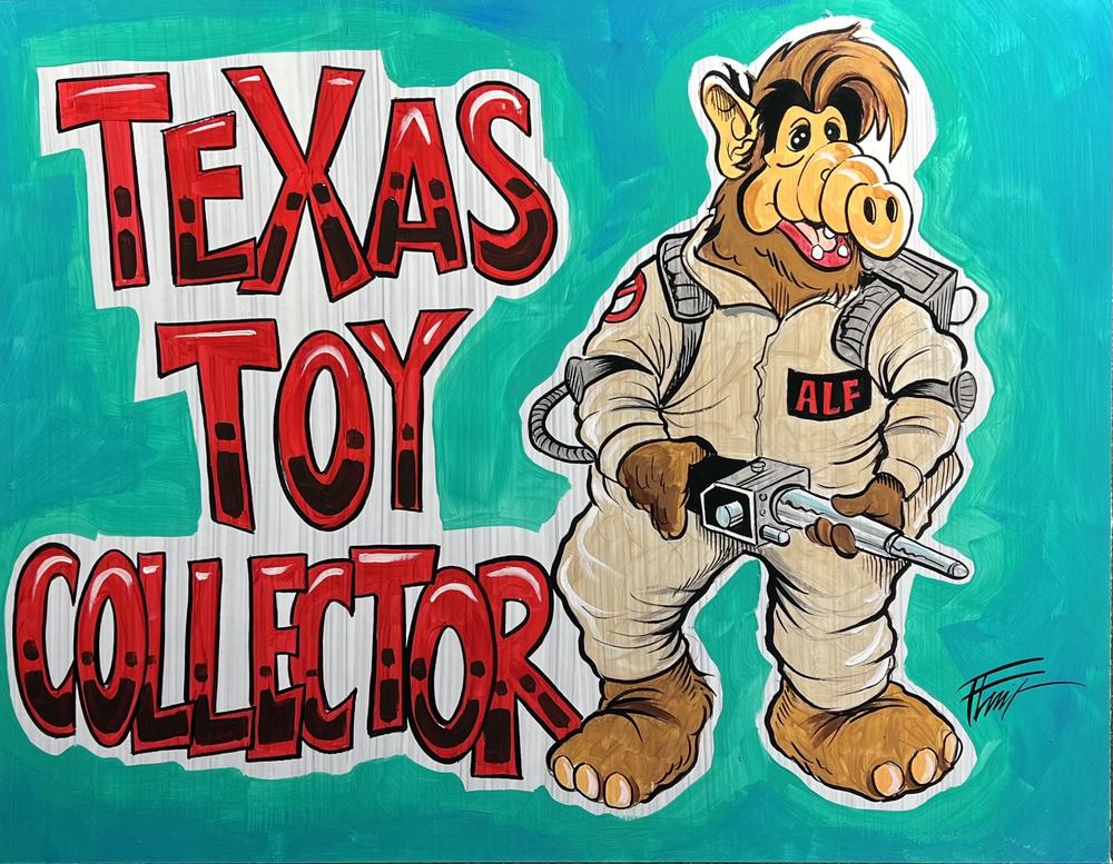 Texas Toy Collector — hand-painted sign logo with Ghostbuster Alf, the shop mascot, holding a proton wand