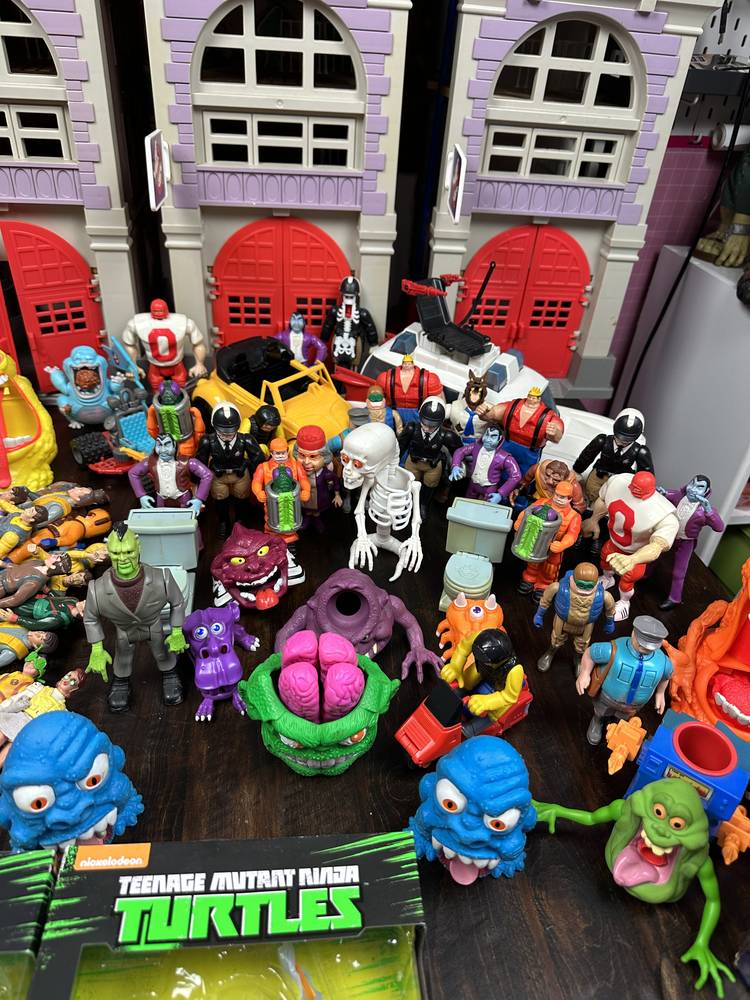 A Real Ghostbusters collection — firehouse playset, Ecto-1, Slimer, haunted humans and ghost figures